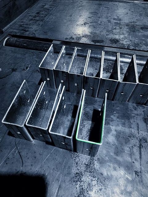 Two rows of U shaped brackets on the table