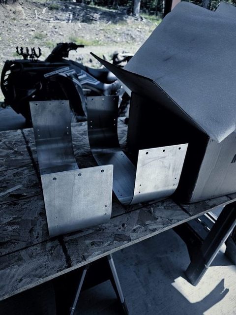 Formed sheet metal pieces with flanges on a bench