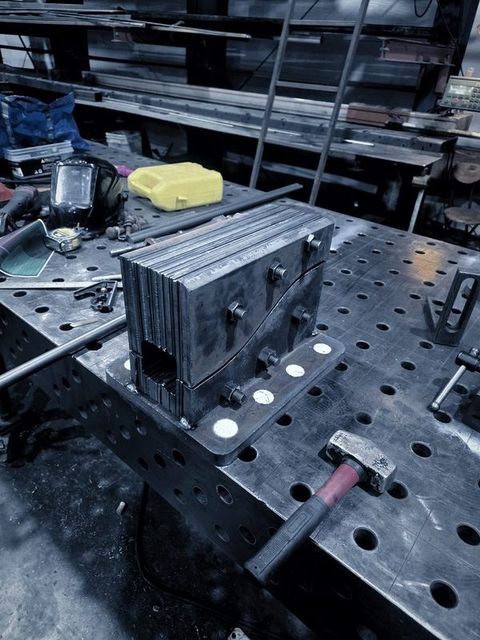 A stack of cut plates standing on the fixture table